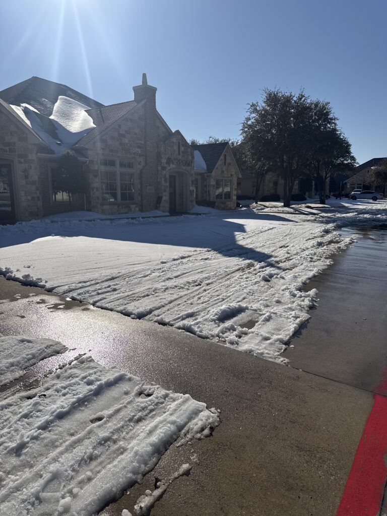 Residential driveway with snow plowed in Haslet, Texas